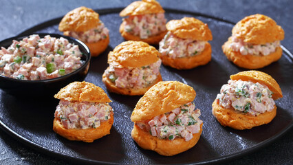 ham salad sandwiched between gougeres, top view