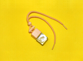 Fototapeta premium Car Air Freshener on yellow background