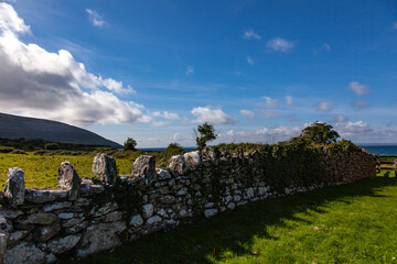 landscape with sky and stone wall in ireland