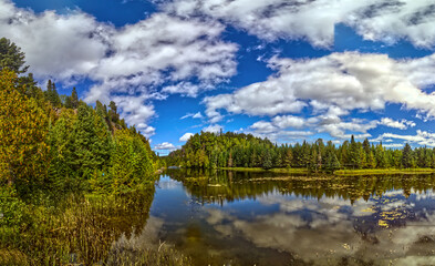 Panoramic view of the lake on a bright afternoon dotted with beautiful clouds, Thunder Bay, ON, Canada