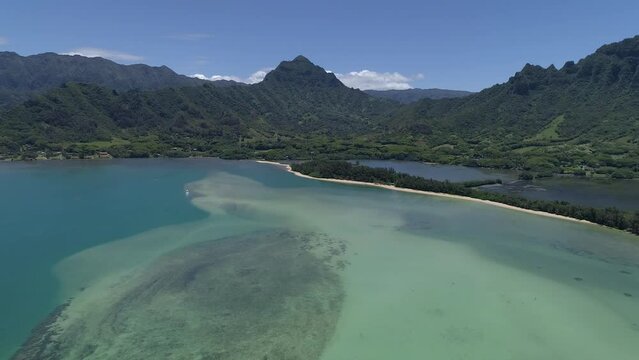 Aerial drone view of the Secret Beach with Koolau Mountains in the background