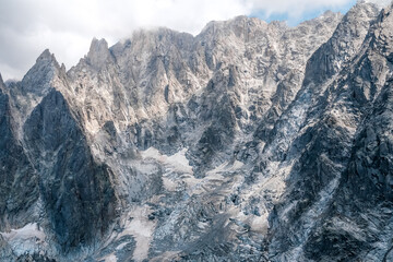 Detail of steep and inaccessible rocky mountains in the alps.