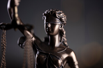 Fototapeta na wymiar Law symbols composition. Law and justice concept. Themis sculpture and judge’s gavel on gray background.