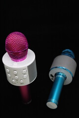 pink and blue microphones 