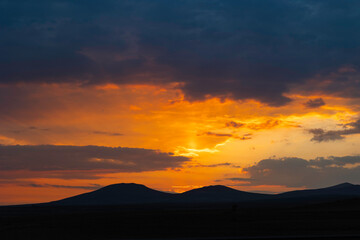 Inspirational quotes concept photo. Silhouette of hills at sunset or sunrise