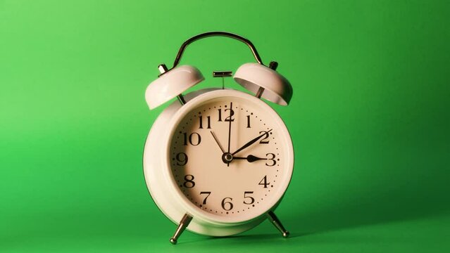 analog clock goes on a green screen, timelapse, fast passage of time.