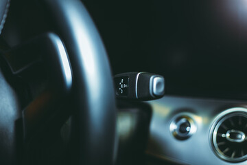 Steering gear shift mode selector focus close-up. The concept of an automobile part. A switch for...