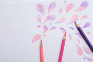Abstract drawing and colorful pencils on white background, top view
