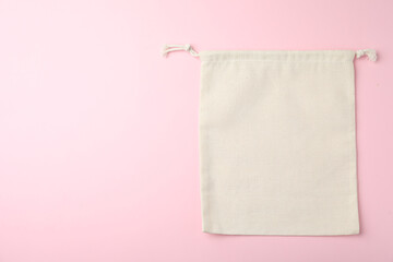 Cotton eco bag on pink background, top view. Space for text