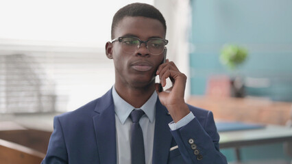 Young African Businessman Talking on Phone