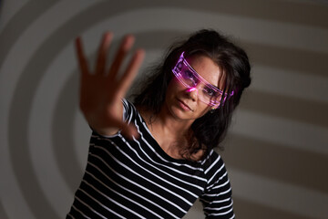 Woman with sci-fi glasses on gray