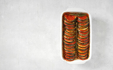 Ratatouille - traditional French Provencal vegetable dish, cooked in square form in oven, top view,...