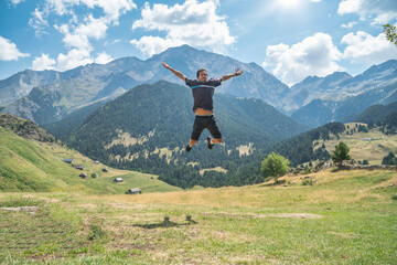 man jumping in a beautiful mountain landscape