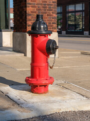 Fototapeta na wymiar red fire hydrant on a city street for emergency protection