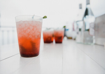 Glass of cocktail with lemon