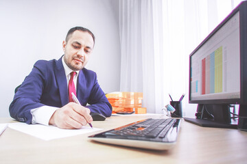 Businessman is signing the contract in office.