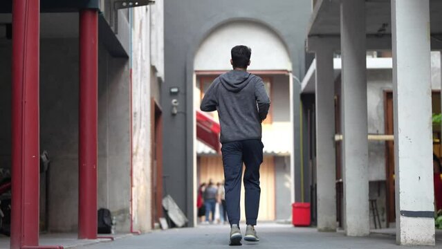 Back Athletic Man In Sportswear For Running On Street Town. Close Up Legs Active Male Spending Free Time For Regular Training Outdoor.