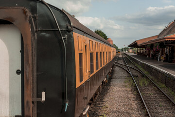 Fototapeta premium Restored Victorian-Era Passenger Rail train at a train station.