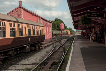 Fototapeta na wymiar Restored Victorian-Era Passenger Rail train at a train station.
