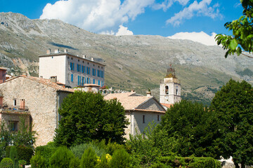 Church and castle of Cipieres in the south of France in summer