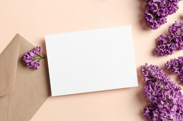 Invitation card mockup with envelope and flowers composition, blank card mockup