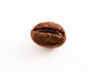 Extreme closeup of single and isolated roasted coffee bean on white background