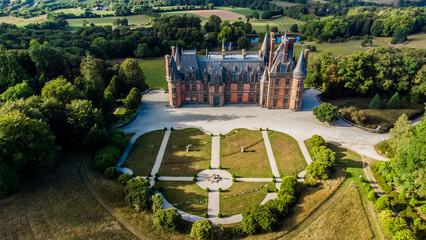 Aerial view of the Castle of Trévarez in Brittany, France - Red brick neo-gothic mansion built on...