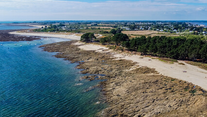 Fototapeta na wymiar Aerial view of the Pointe de Kerpenhir at the entrance of the Gulf of Morbihan in Brittany, France - Rocky peninsula at low tide in the Atlantic Ocean