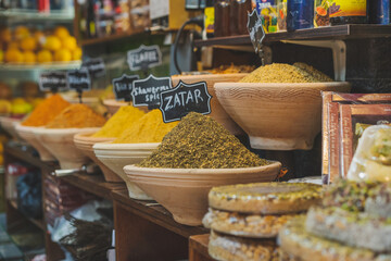 Spices display in a street market fresh colorful spices piles with labels 
