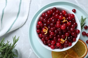 Flat lay composition with fresh ripe cranberries on grey table
