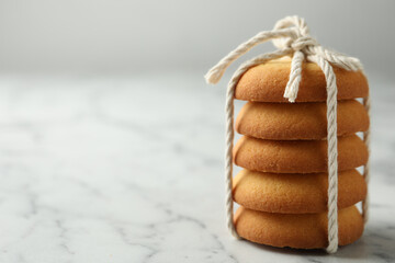 Fototapeta Tasty shortbread cookies on marble table, closeup. Space for text obraz