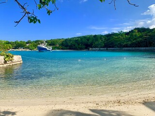 Beach in Jamaica and view of a boat