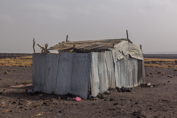 Obraz na płótnie Canvas Metal house in Dodom village under Erta Ale volcano in Afar depression, Ethiopia