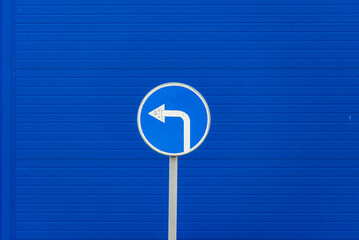 Prescriptive road sign turn left on blue background