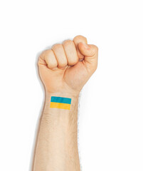 raised hand making a fist gesture of power with Ukraine ukranian flag wrist tattoo, ukrainian power...