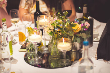 glasses of champagne on the table with candles