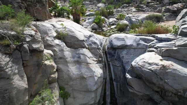 tropical waterfall cobo san lucus mexico with giant rocks desert and forest surrounding it