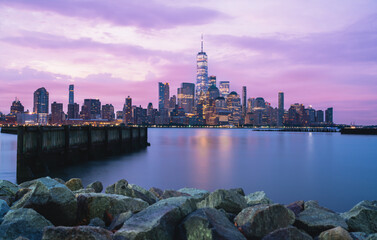 New York City beautiful skyline marina skyscrapers buildings lights sunrise cityscape sky sea river reflections 