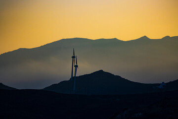 wind turbines on the hill at dawn