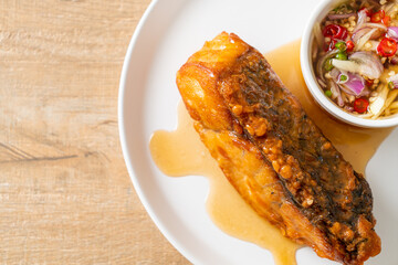 fried snapper fish with fish sauce and spicy salad