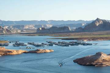 Serene Lake Powell Marina With Boats and Red Rock Formations During Sunset