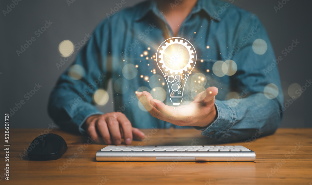 Aufkleber Innovation. Hands holding light bulb for Concept new idea concept with innovation and inspiration, innovative technology in science and communication concept...