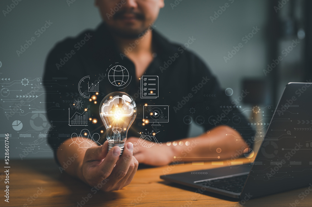 Leinwandbilder man hand holding light bulb global internet connection. business global internet connection applicat