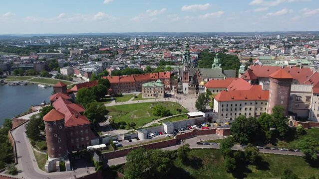 Flyover of the Wawel Royal Castle Cathedral on the Vistula (Wisła) River - Krakow, Poland, a Polish cultural capital, medieval and renaissance architecture, city center - 4K 30FPS Tracking Forward