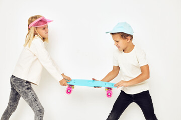 Modern teenagers posing together posing games fun light background