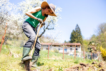Mid Adult Female Farmer Dug Agricultural Field with Her Hands