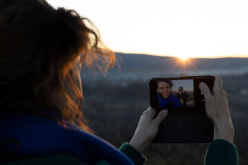 Woman Taking a Selfie with Her Boyfriend in the Composition Making a Photograph of Her taking a Selfy