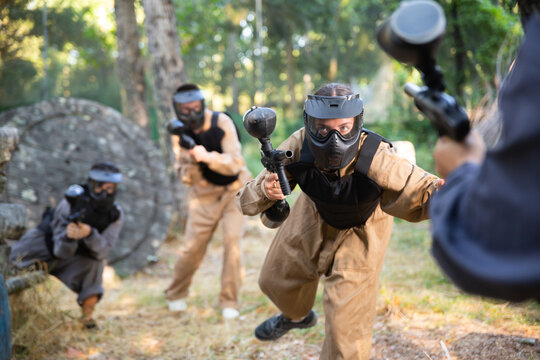 Attack of the paintball team on the enemy at the army training ground