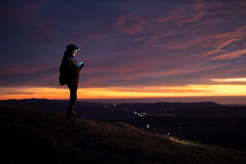 Mid Adult Woman Using For Navigation a Mobile Phone From A Remote location High Above a Valley