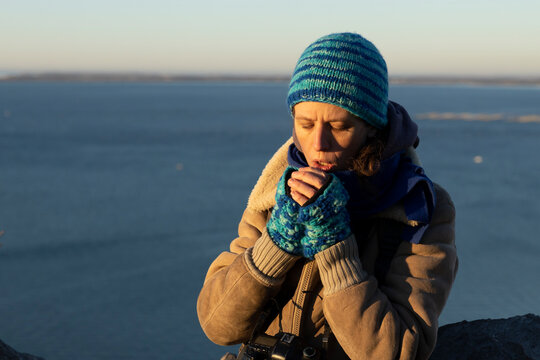 Cold Winter morning for a Female Photographer Waiting for a Sunrise on Sea Photograph